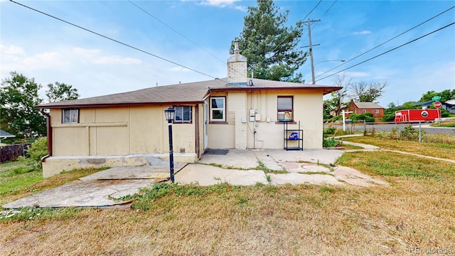 598 S Navajo St, Denver, CO 80223 - back of property with a chimney