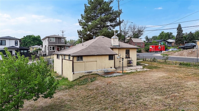 598 S Navajo St, Denver, CO 80223 - rear view of house with a residential view and a patio area