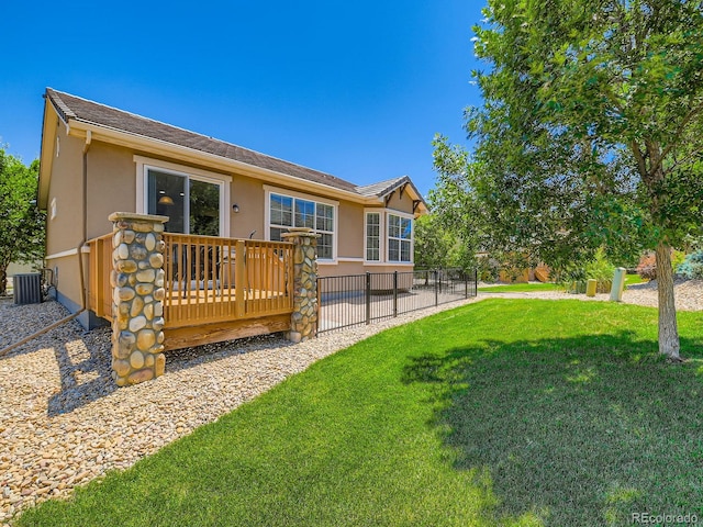 4561 Hope Cir, Broomfield, CO 80023 - rear view of house featuring stucco siding and a wooden deck