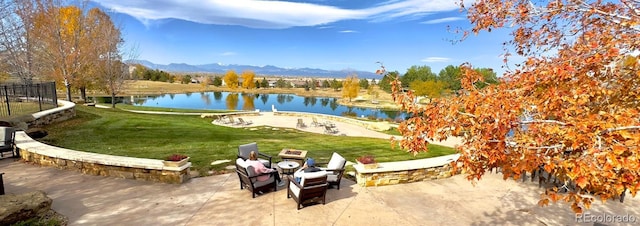 4561 Hope Cir, Broomfield, CO 80023 - surrounding community featuring a water and mountain view, a lawn, a patio, and view of golf course