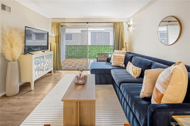 living room with light hardwood / wood-style flooring