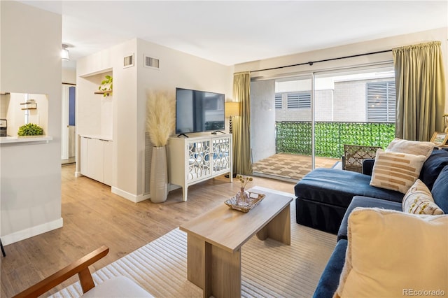 living room with light hardwood / wood-style floors