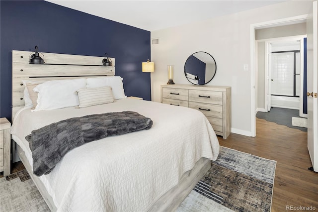 bedroom with wood-type flooring