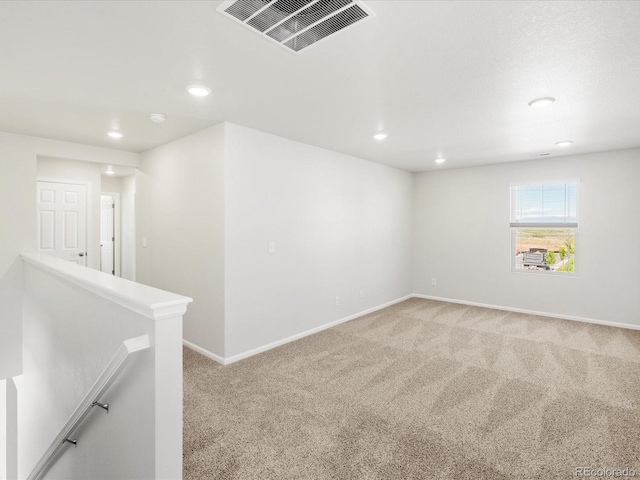 8850 Sedalia St, Commerce City, CO 80022 - spare room with light colored carpet, recessed lighting, and baseboards