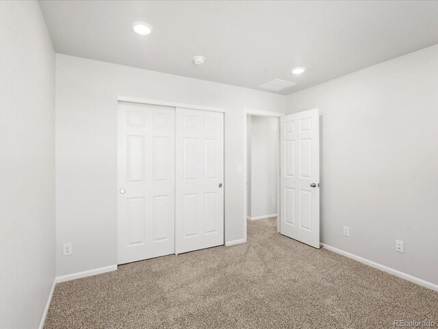 8850 Sedalia St, Commerce City, CO 80022 - unfurnished bedroom featuring carpet floors, baseboards, a closet, and recessed lighting