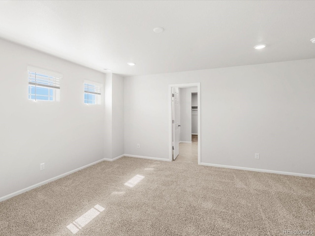 8850 Sedalia St, Commerce City, CO 80022 - spare room with light colored carpet, baseboards, and recessed lighting