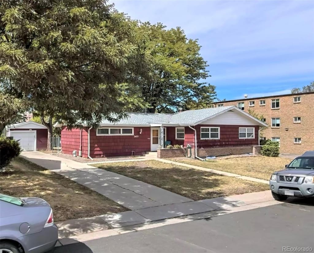 3475 S Marion St, Englewood, CO 80113 - ranch-style home with a front lawn, an outbuilding, and driveway