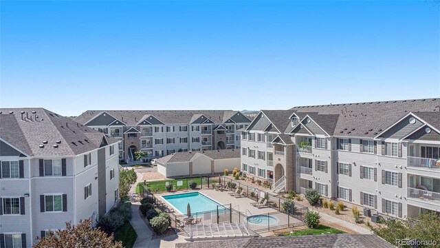 view of pool with a patio and cooling unit