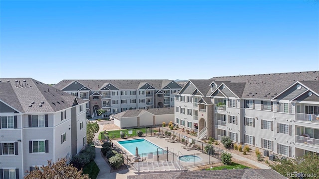 birds eye view of property with a residential view