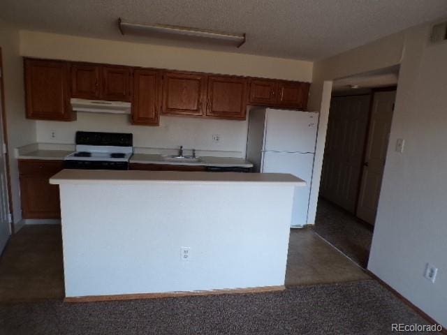 kitchen featuring white appliances, carpet flooring, a center island, and sink