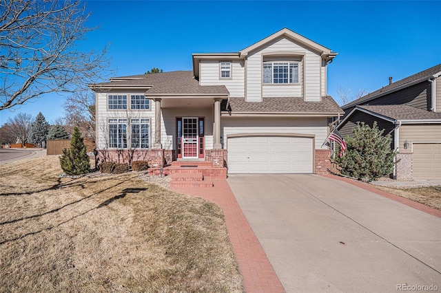 traditional home featuring concrete driveway, brick siding, roof with shingles, and an attached garage