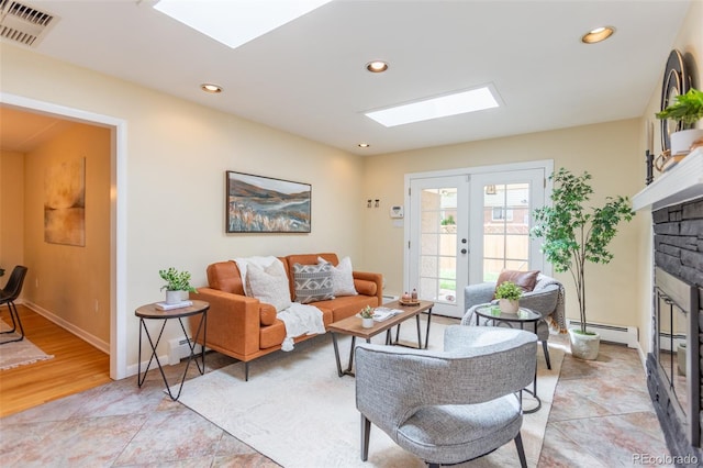 3098 S Vine St, Denver, CO 80210 - living area featuring a skylight, a fireplace, a baseboard radiator, french doors, and recessed lighting