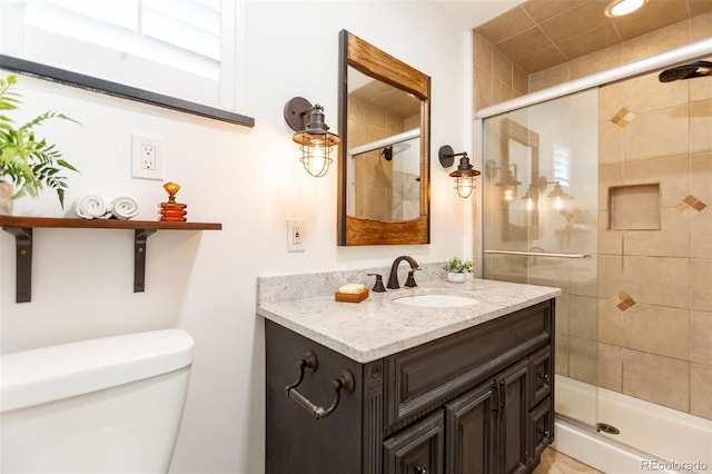 3098 S Vine St, Denver, CO 80210 - bathroom with toilet, vanity, and a shower stall