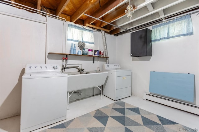 3098 S Vine St, Denver, CO 80210 - laundry area with washing machine and clothes dryer and a baseboard heating unit