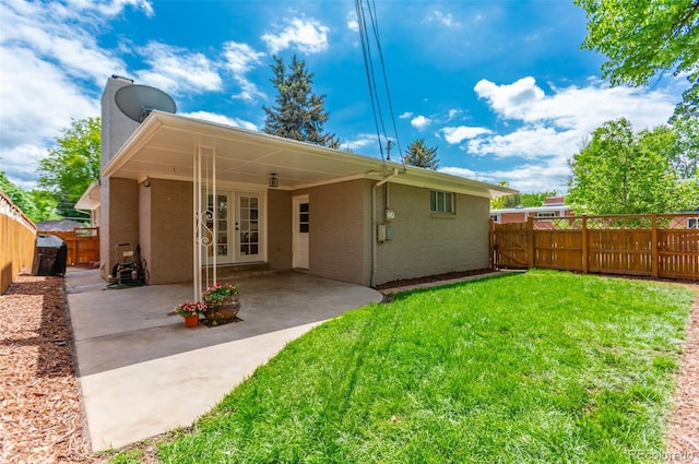 3098 S Vine St, Denver, CO 80210 - rear view of property with brick siding, a gate, a chimney, a patio area, and french doors