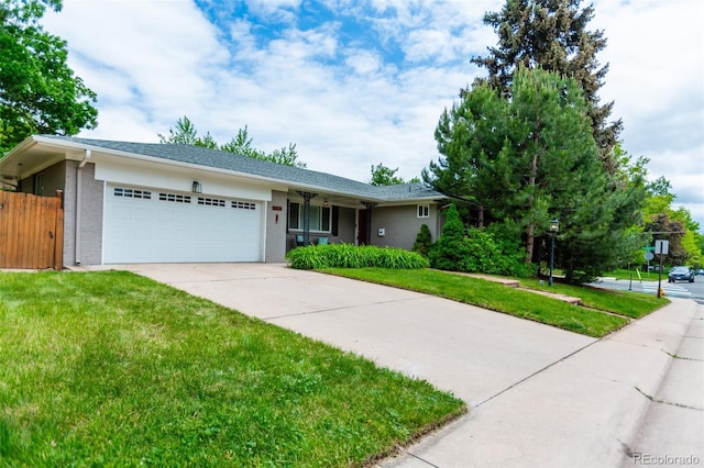 3098 S Vine St, Denver, CO 80210 - single story home with a garage, concrete driveway, and brick siding