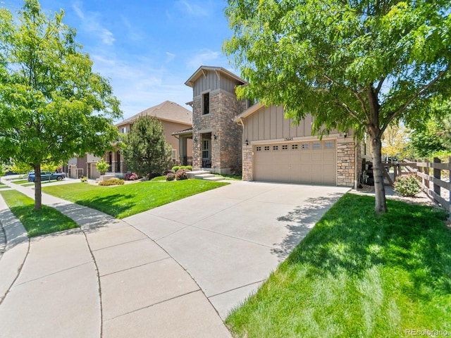13645 Osage Ct, Broomfield, CO 80023 - view of front facade featuring stone siding, board and batten siding, driveway, and a garage