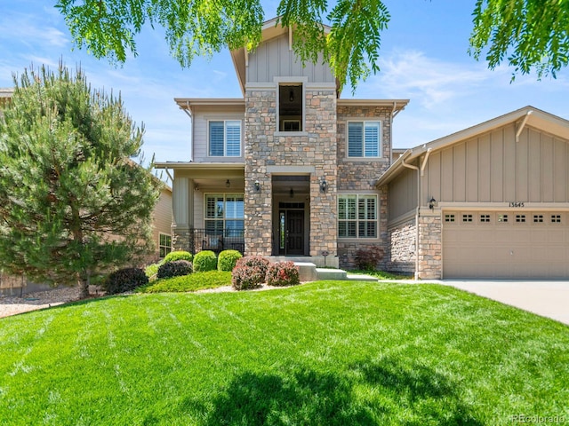 13645 Osage Ct, Broomfield, CO 80023 - view of front of house with stone siding, board and batten siding, a front yard, and a garage