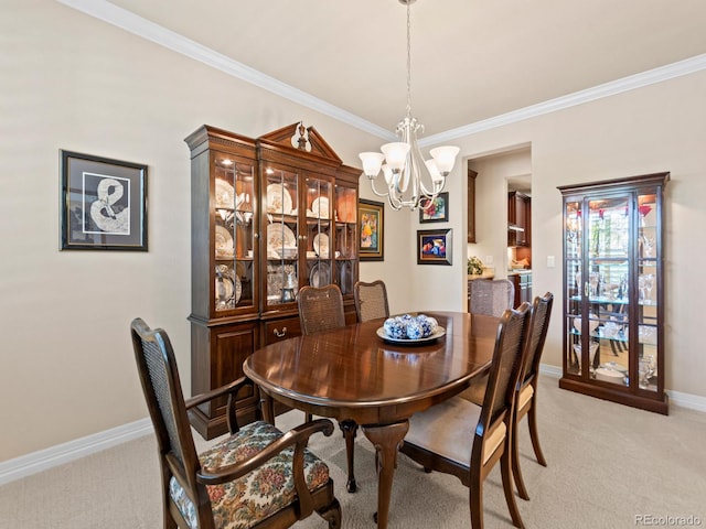 13645 Osage Ct, Broomfield, CO 80023 - dining room featuring a chandelier, light carpet, and crown molding