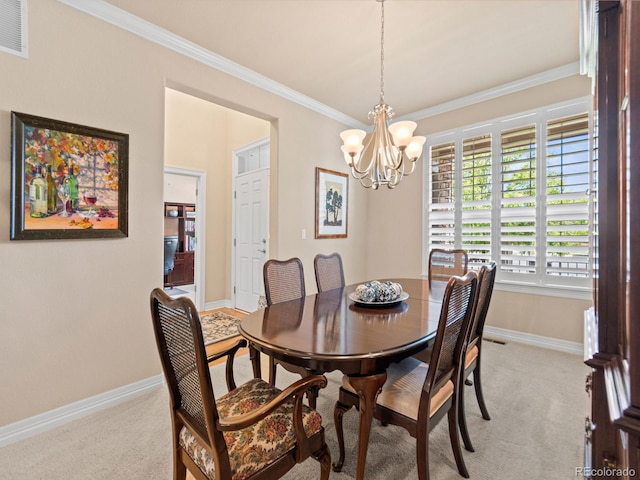 13645 Osage Ct, Broomfield, CO 80023 - dining space with ornamental molding, light colored carpet, and a chandelier