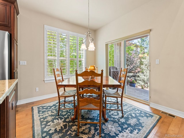 13645 Osage Ct, Broomfield, CO 80023 - dining room featuring light wood-type flooring and baseboards