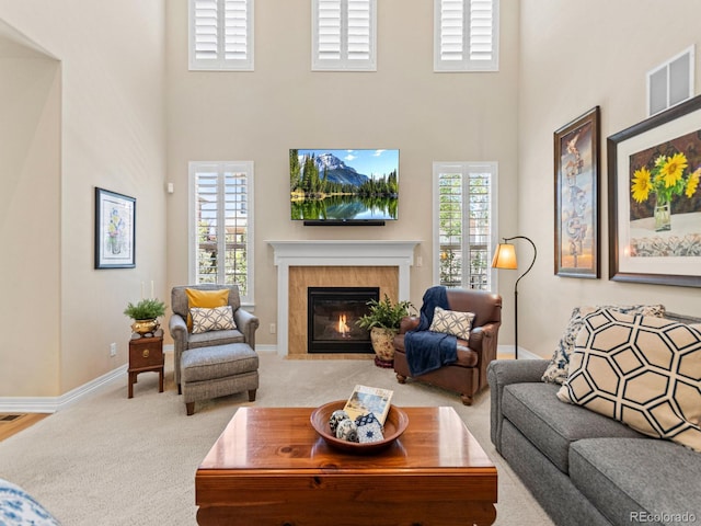 13645 Osage Ct, Broomfield, CO 80023 - living room with a high ceiling, carpet floors, and a fireplace