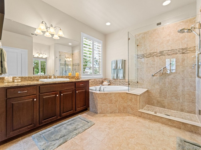 13645 Osage Ct, Broomfield, CO 80023 - full bathroom with a shower stall, a garden tub, vanity, healthy amount of natural light, and recessed lighting