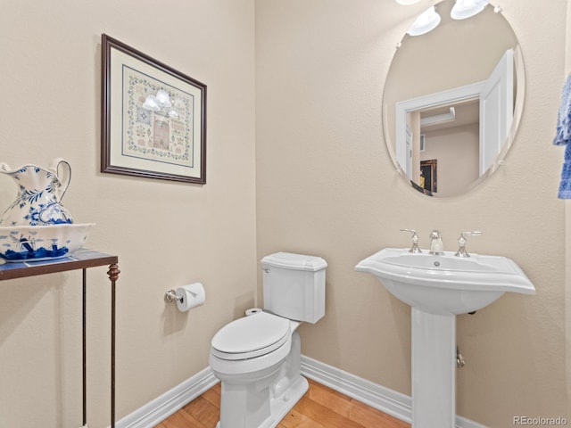 13645 Osage Ct, Broomfield, CO 80023 - bathroom with toilet and wood finished floors