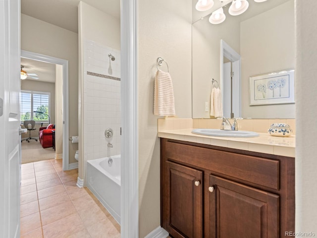 13645 Osage Ct, Broomfield, CO 80023 - bathroom with vanity, tile patterned floors, bathing tub / shower combination, and a ceiling fan