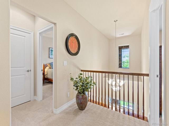 13645 Osage Ct, Broomfield, CO 80023 - hall featuring carpet floors and a chandelier