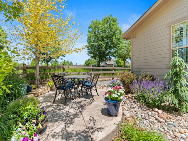 13645 Osage Ct, Broomfield, CO 80023 - fenced backyard featuring a patio area and outdoor dining area