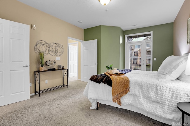 bedroom with access to exterior, carpet, and baseboards