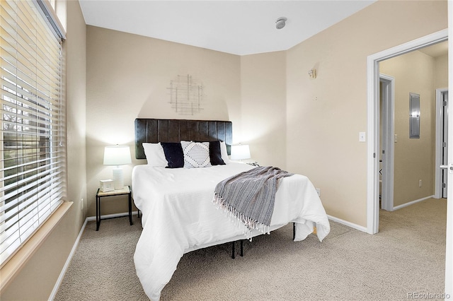 bedroom featuring carpet flooring and baseboards
