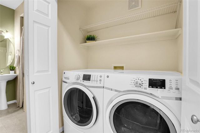 washroom featuring washer and dryer