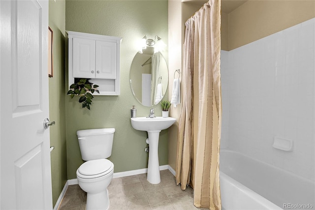 bathroom featuring toilet, tile patterned flooring, shower / bathtub combination with curtain, and baseboards