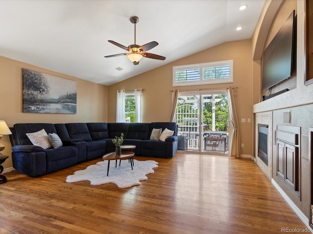 885 Sage Sparrow Cir, Highlands Ranch, CO 80129 - living area featuring ceiling fan, lofted ceiling, wood finished floors, a tile fireplace, and recessed lighting