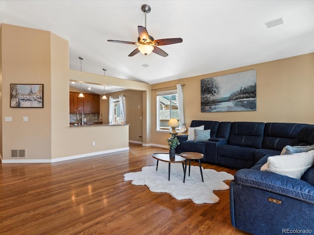 885 Sage Sparrow Cir, Highlands Ranch, CO 80129 - living room featuring wood finished floors, a ceiling fan, and vaulted ceiling