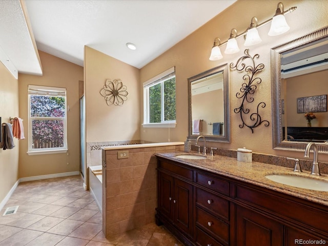 885 Sage Sparrow Cir, Highlands Ranch, CO 80129 - full bath featuring vaulted ceiling, double vanity, a tub, tile patterned floors, and a shower with door