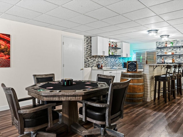885 Sage Sparrow Cir, Highlands Ranch, CO 80129 - dining area featuring dark wood-type flooring, bar area, and a drop ceiling