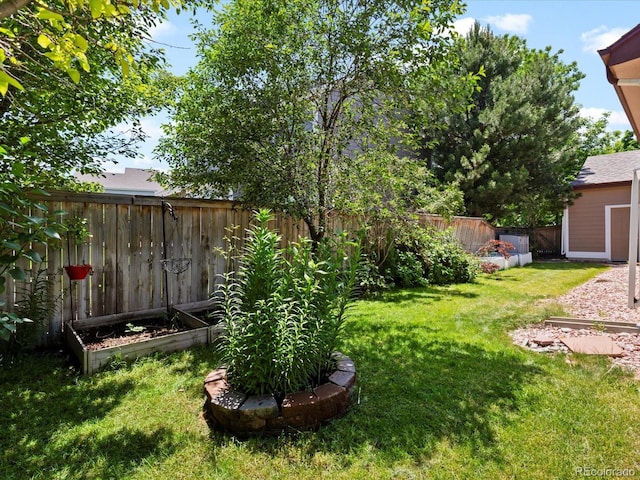 885 Sage Sparrow Cir, Highlands Ranch, CO 80129 - fenced backyard featuring a garden and an outbuilding