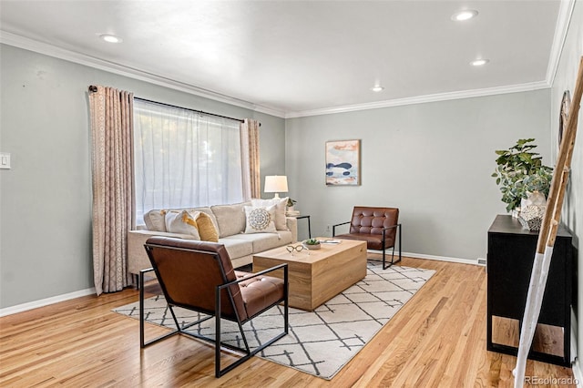 living room with crown molding and light wood-type flooring