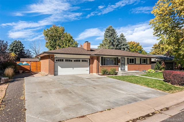 single story home featuring a front yard and a garage