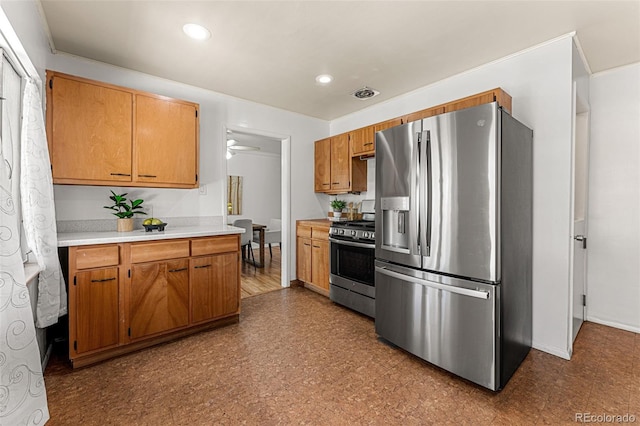 kitchen with ceiling fan and stainless steel appliances