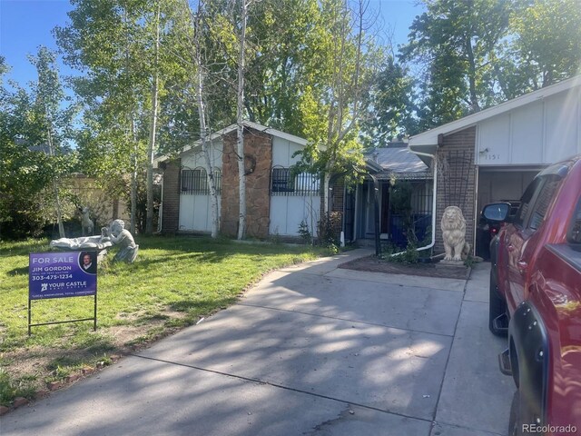 view of side of home featuring a yard