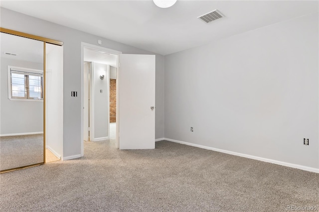 unfurnished bedroom with carpet and a closet