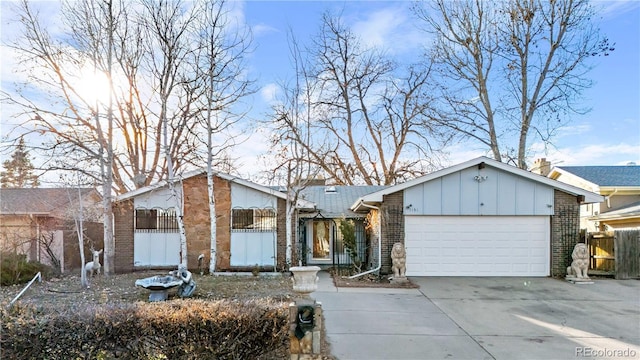 ranch-style home featuring a garage