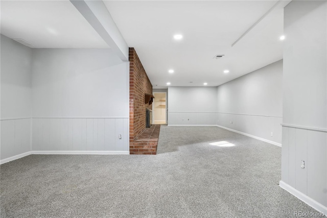 unfurnished living room with a fireplace and carpet floors