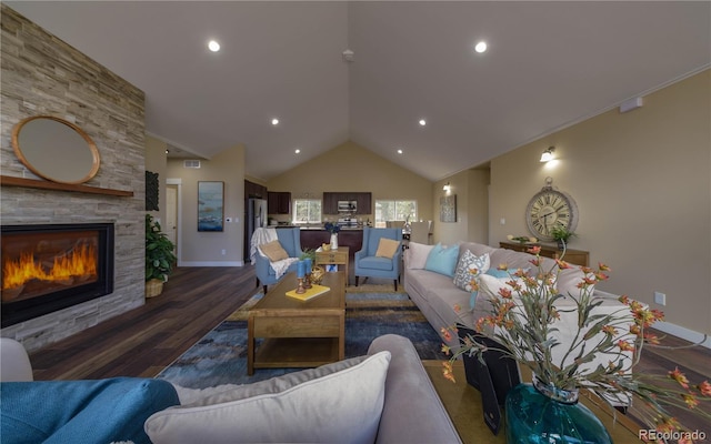 living room with a fireplace, dark hardwood / wood-style floors, and vaulted ceiling