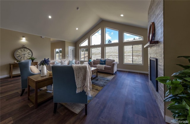 living room with dark wood-type flooring, high vaulted ceiling, and a fireplace