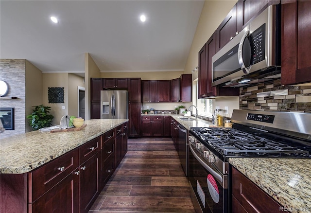 kitchen featuring ornamental molding, stainless steel appliances, dark wood-type flooring, and decorative backsplash